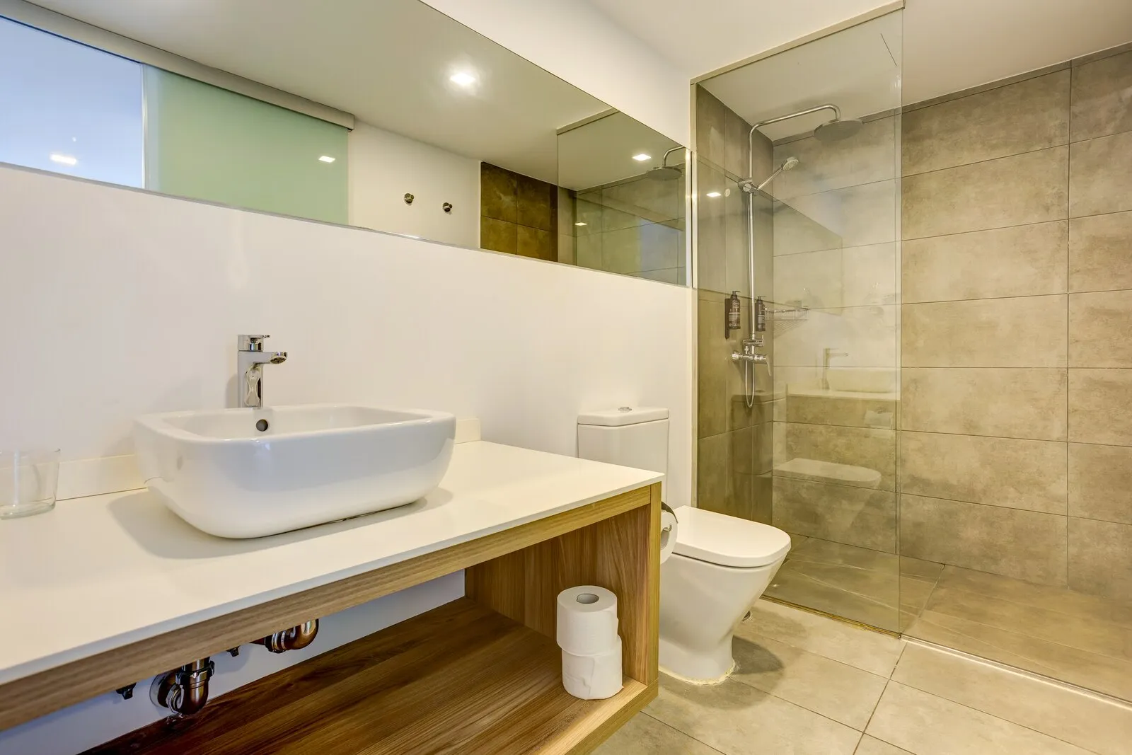 Apartment 205 bathroom, with the basin beside a glass walk-in shower